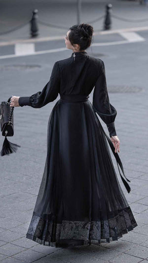 Black Mamian Featuring a diverse collection of Hanfu styles, this display presents a blend of traditional and modern elements, from the intricate embroidery of classic Hanfu to contemporary menswear. The assortment includes authentic Tang Dynasty dresses and detailed Ming Dynasty Hanfu, alongside luxurious royal attire and scholar officials' outfits. With a special emphasis on men's Hanfu, the exhibit highlights the rich cultural tapestry of traditional Asian clothing and modern, Asian-inspired fashion