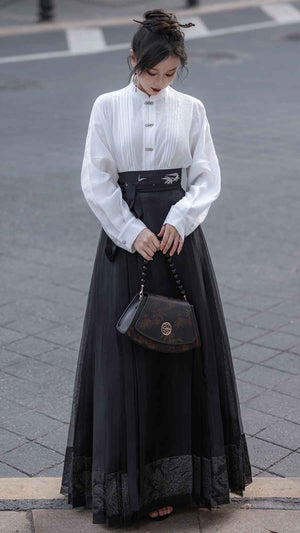 Black Mamian Featuring a diverse collection of Hanfu styles, this display presents a blend of traditional and modern elements, from the intricate embroidery of classic Hanfu to contemporary menswear. The assortment includes authentic Tang Dynasty dresses and detailed Ming Dynasty Hanfu, alongside luxurious royal attire and scholar officials' outfits. With a special emphasis on men's Hanfu, the exhibit highlights the rich cultural tapestry of traditional Asian clothing and modern, Asian-inspired fashion