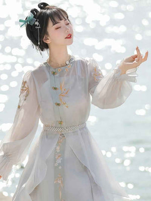 Blue Modern Hanfu Featuring a diverse collection of Hanfu styles, this display presents a blend of traditional and modern elements, from the intricate embroidery of classic Hanfu to contemporary menswear. The assortment includes authentic Tang Dynasty dresses and detailed Ming Dynasty Hanfu, alongside luxurious royal attire and scholar officials' outfits. With a special emphasis on men's Hanfu, the exhibit highlights the rich cultural tapestry of traditional Asian clothing and modern, Asian-inspired fashion