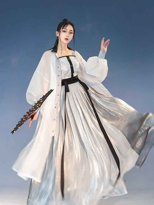 White Featuring a diverse collection of Hanfu styles, this display presents a blend of traditional and modern elements, from the intricate embroidery of classic Hanfu to contemporary menswear. The assortment includes authentic Tang Dynasty dresses and detailed Ming Dynasty Hanfu, alongside luxurious royal attire and scholar officials' outfits. With a special emphasis on men's Hanfu, the exhibit highlights the rich cultural tapestry of traditional Asian clothing and modern, Asian-inspired fashion