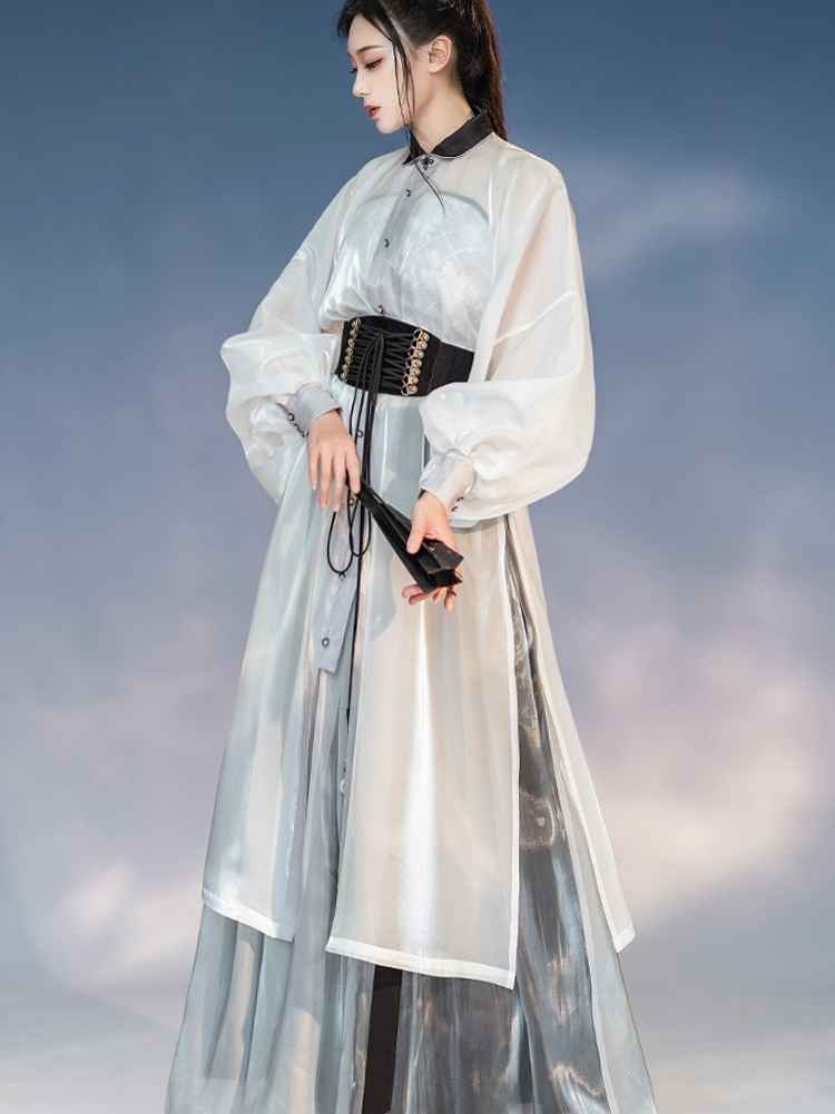 White Featuring a diverse collection of Hanfu styles, this display presents a blend of traditional and modern elements, from the intricate embroidery of classic Hanfu to contemporary menswear. The assortment includes authentic Tang Dynasty dresses and detailed Ming Dynasty Hanfu, alongside luxurious royal attire and scholar officials' outfits. With a special emphasis on men's Hanfu, the exhibit highlights the rich cultural tapestry of traditional Asian clothing and modern, Asian-inspired fashion