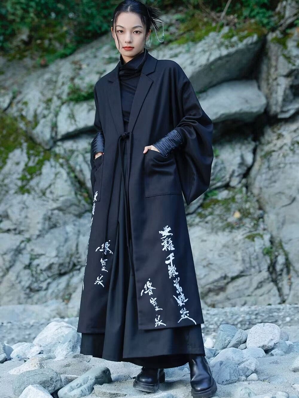 Modern Chinese clothes featuring a black hanfu coat for men, a blend of traditional hanfu menswear and Tang dynasty clothing with a modernized hanfu style, suitable for casual wear or winter hanfu style. The male model is also wearing Chinese cloak and hanfu with pants, depicting a Chinese warrior outfit. The photo indicates where to buy hanfu, including hanfu Amazon and oriental clothing stores near you