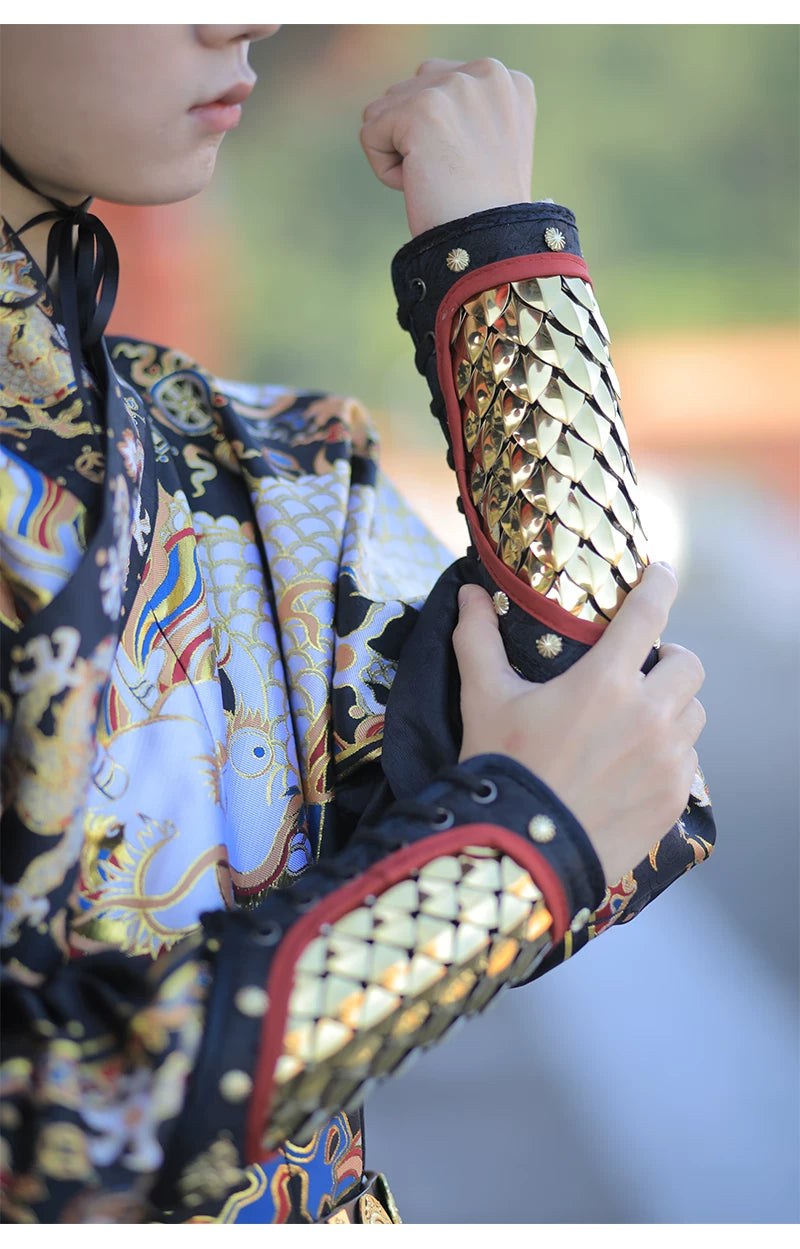 Close-up of reflective silver scale armor panels, red edging, and brass dragon accents