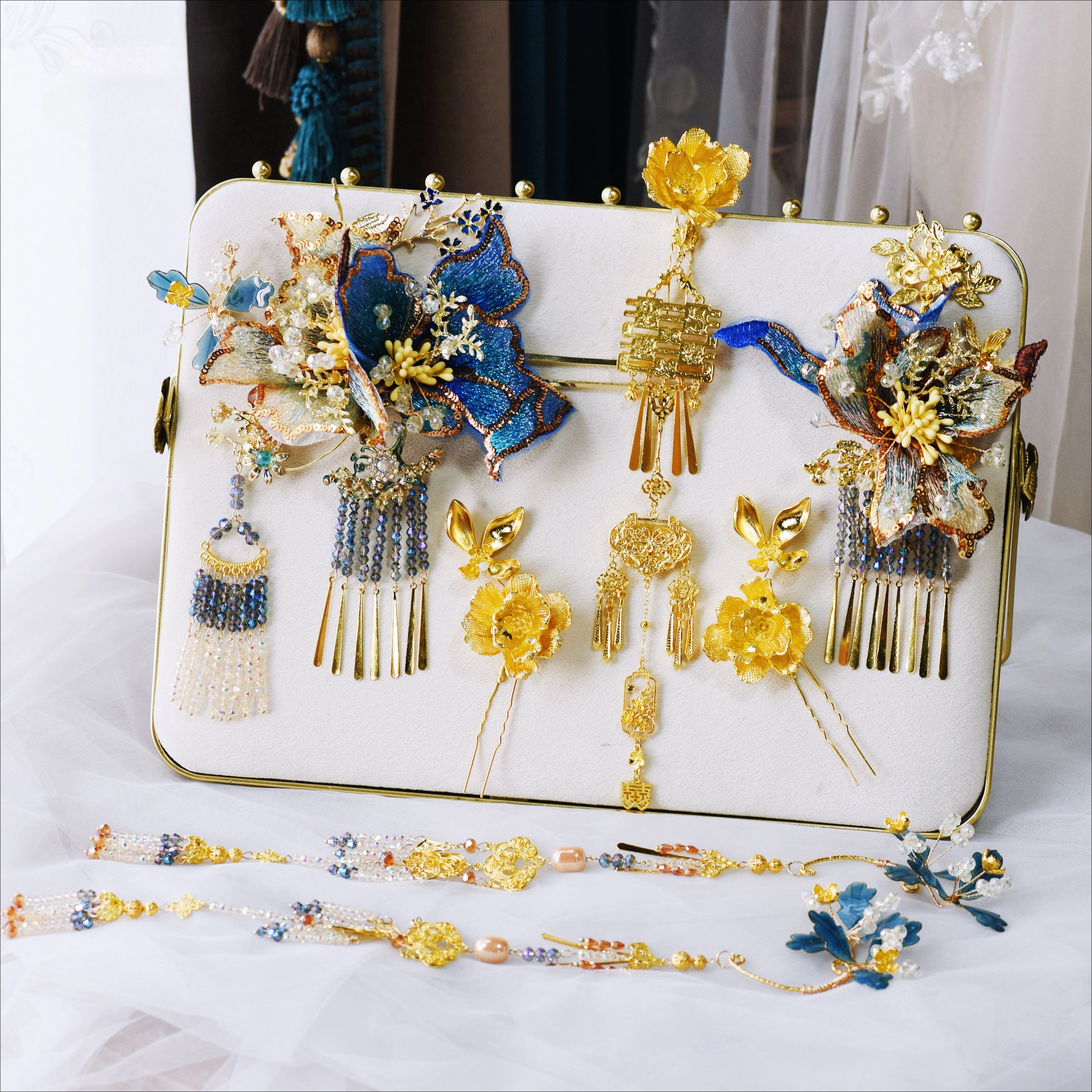 Detailed display of blue lace gold fringed step hairpins and accessories, designed for Hanfu bridal styling and cheongsam dress enhancement.