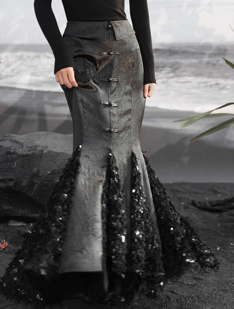 Step into sophistication with our New Chinese-inspired ensemble: a dark fishtail skirt paired elegantly with a black trumpet sweater top. Accentuated with sequined feather satin details, this ensemble exudes luxury and modern elegance. Explore our collection for timeless pieces that seamlessly blend classic Chinese style with contemporary design sensibilities.