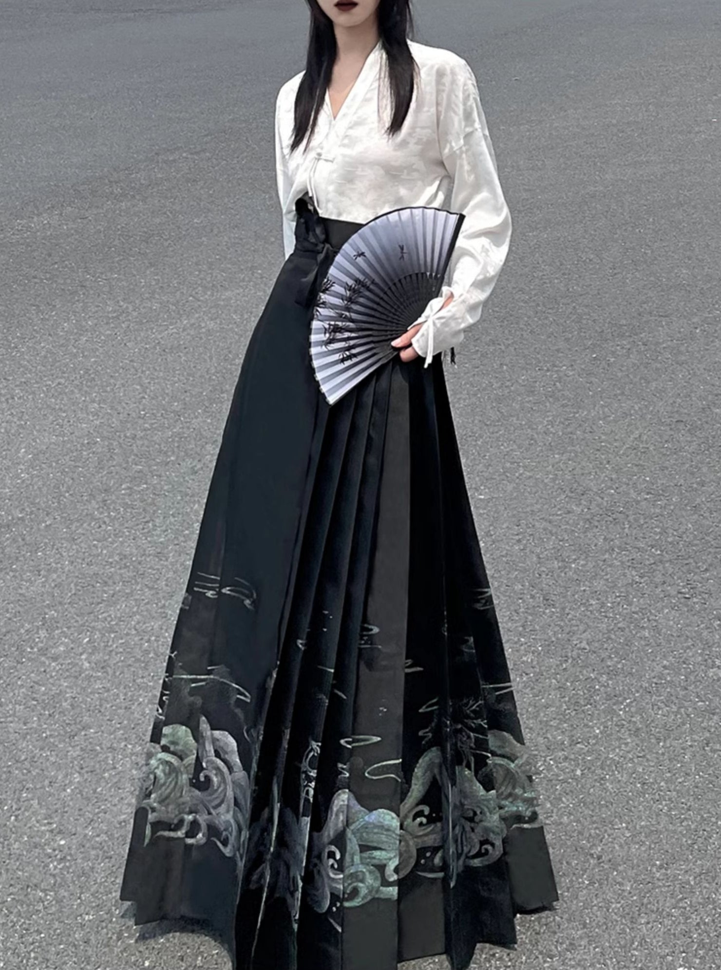 Explore modern elegance with our Black & White Shirt Women's Horse Face Skirt Suit. This ensemble blends traditional Hanfu design with contemporary flair, featuring intricate embroidery and authentic details. Embrace the timeless beauty of Hanfu fashion and make a statement with your unique style.