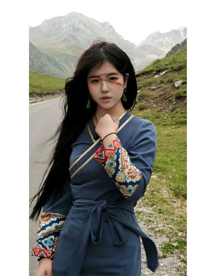 Authentic mist blue brocade dress refined tibetan inspired oriental elegance silhouette for events standing front