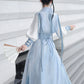 Blue hanfu dress for women, blending traditional Song Dynasty and modern Chinese styles, crafted from luxurious silk. This versatile hanfu includes options for a matching coat or jacket, making it suitable for winter wear, Chinese New Year celebrations, or casual outings. Ideal for occasions like graduations or cosplay, this dress embodies the fairy-inspired elegance of classic hanfu while also drawing from martial arts clothing and contemporary Chinese fashion. Available for purchase in our online hanfu sh