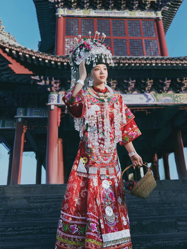 Elegant authentic miao minority wedding dress heirloom quality red brocade traditional bridal costume side view

