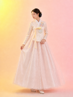 Elegant women hanbok white long sleeve jeogori with blush pink full chima skirt and yellow bow bridal style for women side view

