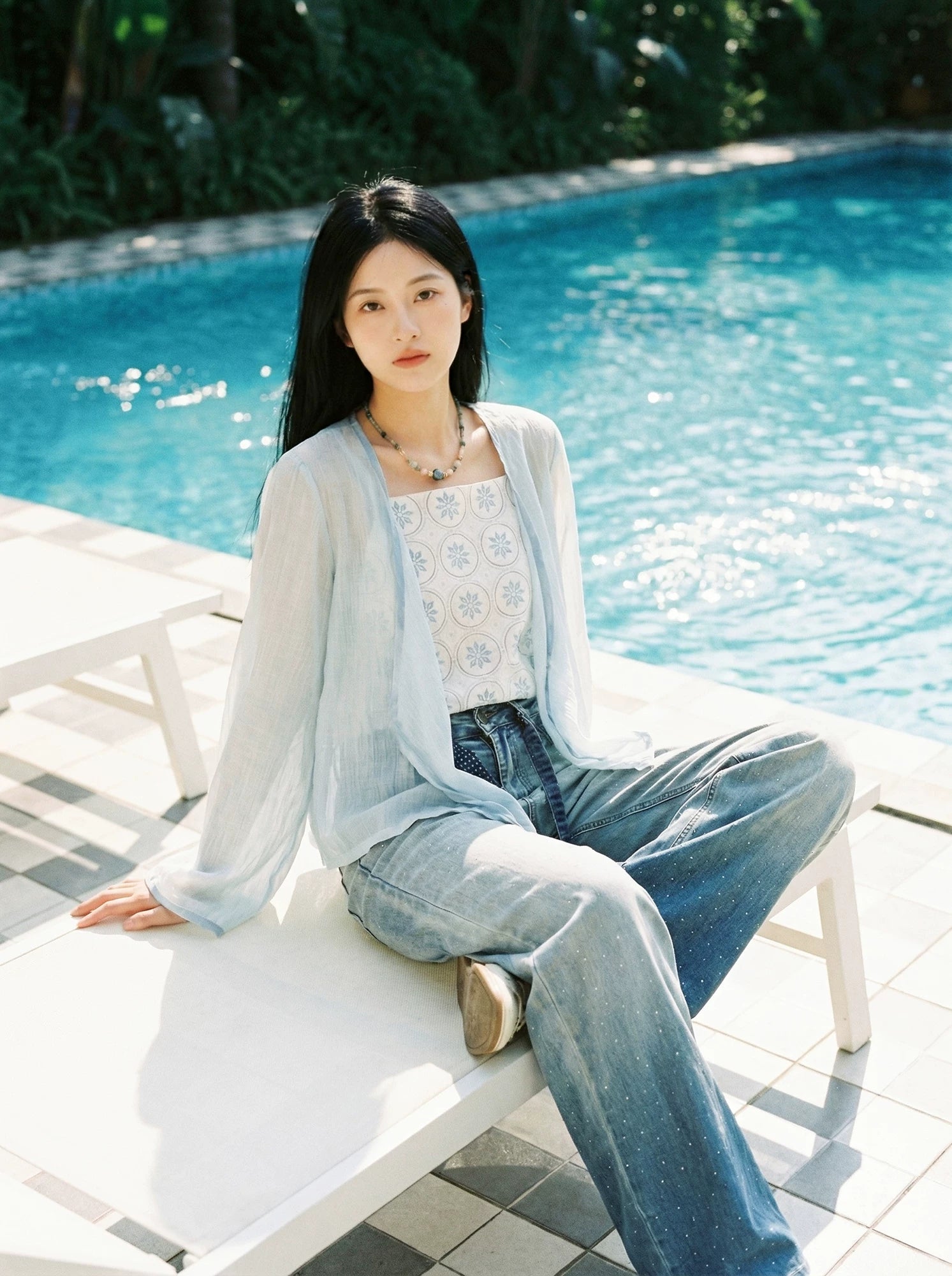Elegant xiaolu water blue summer commuter set small flower brick cross neck tencel top with bud shorts and sunscreen long sleeve side view