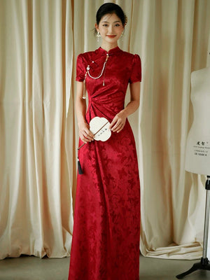 Red jacquard cheongsam dress with pearl chain, model holding fan