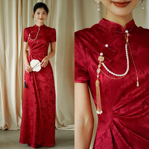 Red jacquard cheongsam dress with pearl accessories, model holding fan