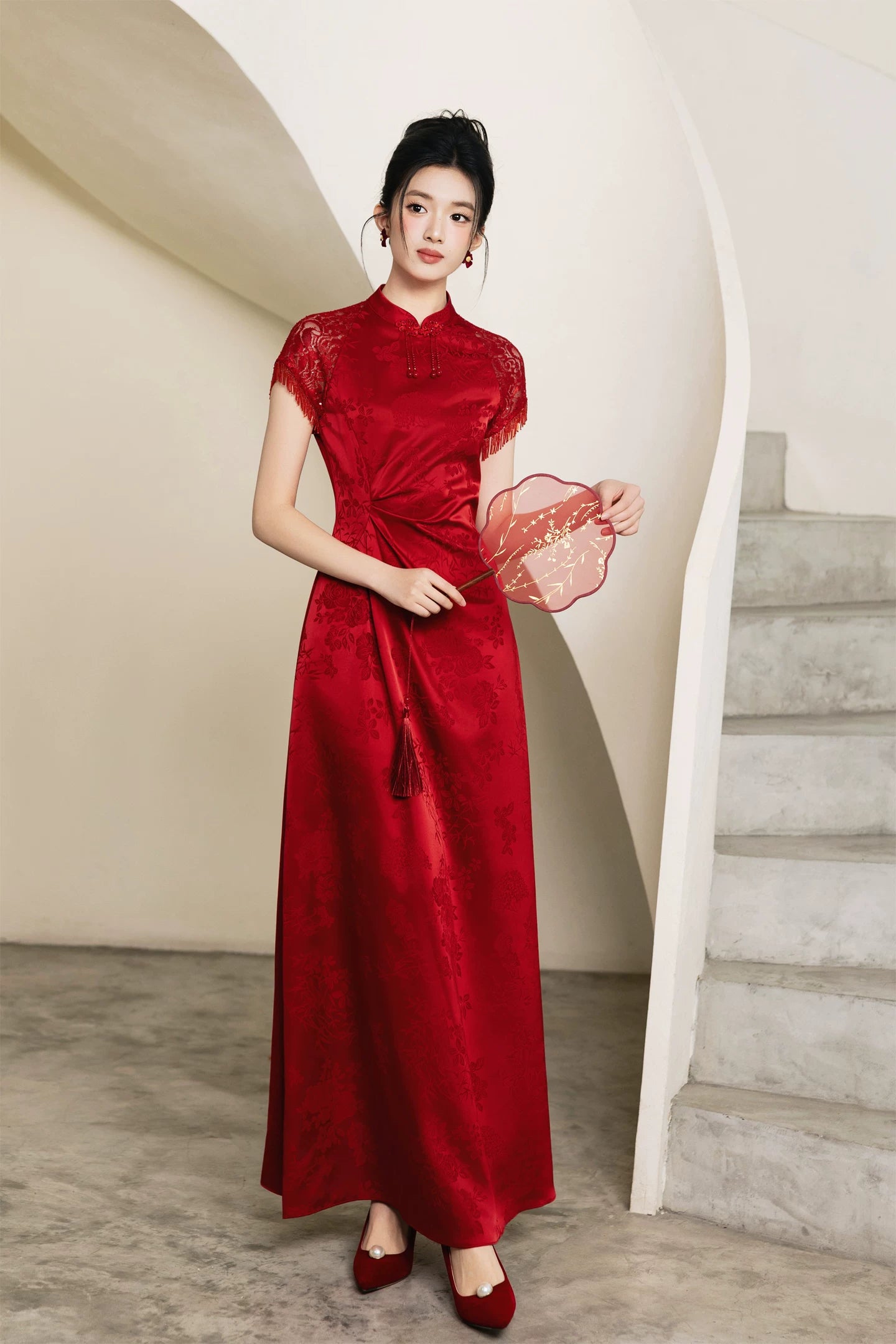 Red bridal cheongsam with ruched waist and embroidered round fan