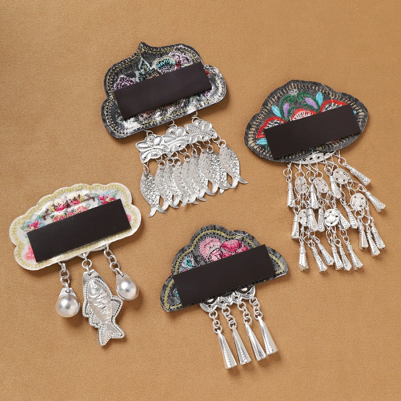 Back view of Guizhou Miao fridge magnets showing magnetic strips and embroidered bases, ideal for cultural refrigerator decoration.