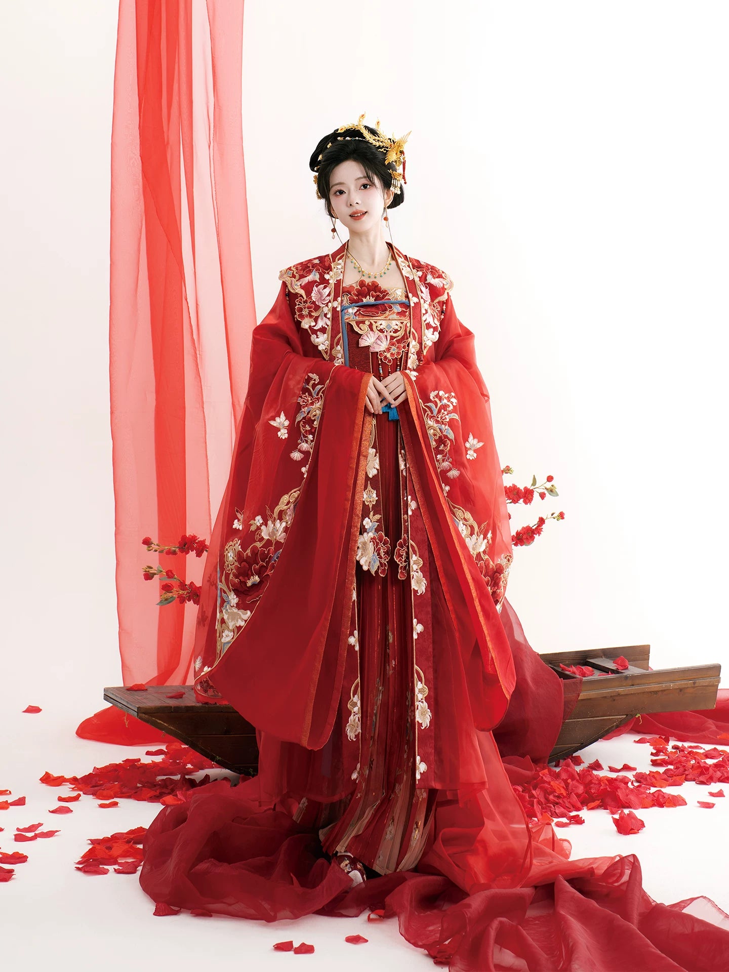 Tang-style bridal Hanfu outfit showing embroidered robe and chest-high skirt styling