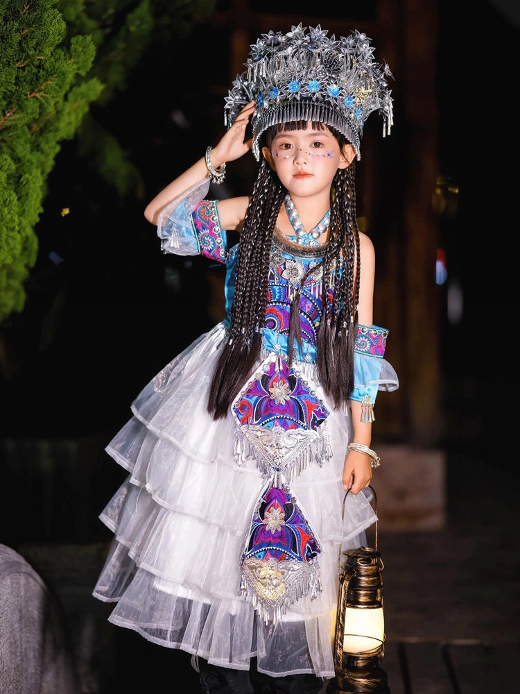 Traditional Chinese girls' stage costume in Miao Purple with ornate silver headdress and embroidered ethnic patterns for walk shows.