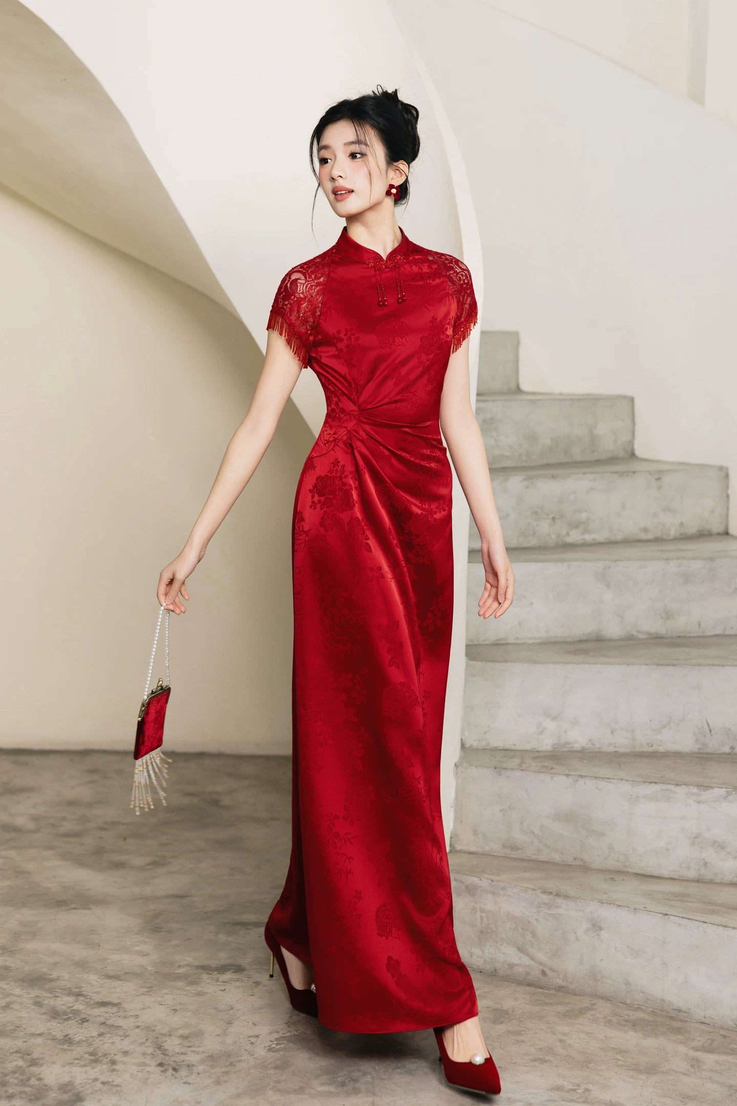 Full-length red A-line cheongsam in walking pose with tassel fan