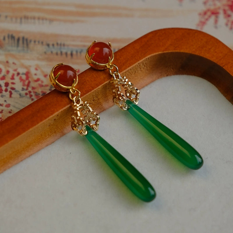 Elegant green agate drop earrings featuring red gemstone tops and intricate gold detailing, perfect for high-end Chinese traditional outfits.