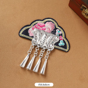 Black embroidered Guizhou Miao fridge magnet with butterfly and silver cone fringe, 8.8x8cm, handmade ethnic accessory.
