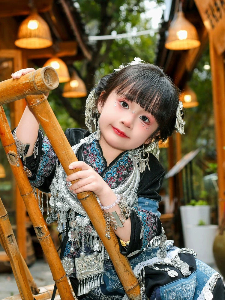Miao blue dress for girls Dai dance costume with silver jewelry, perfect for traditional Chinese performances and cultural events.