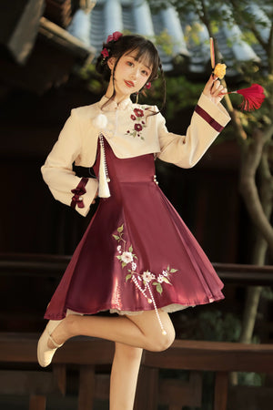 Short Lolita cheongsam dress with cream top, burgundy pleated skirt, floral embroidery, and pearl tassel accents.