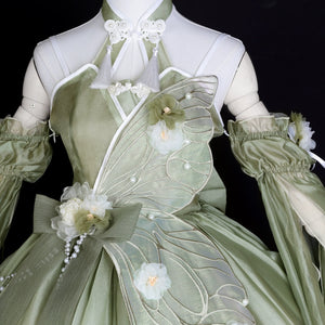 Close-up of bodice on Green Lolita Dress with butterfly wing design and flower appliqué, highlighting elegant craftsmanship.