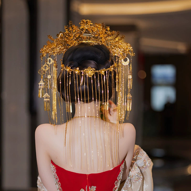 Back view of golden bridal headdress with cascading chains and floral motifs, designed for Chinese wedding hair accessories.