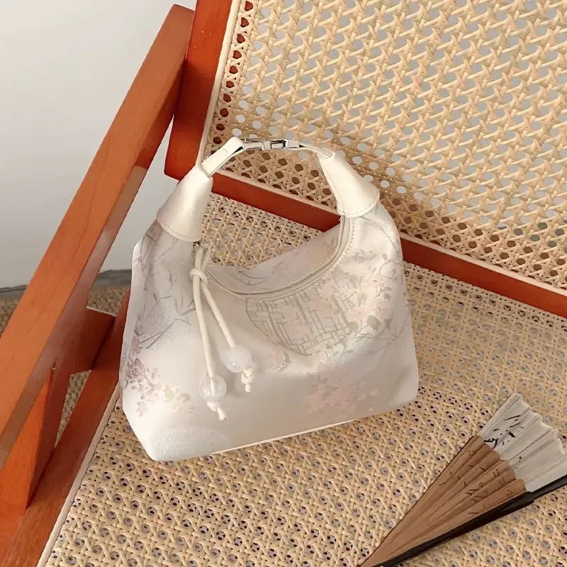 Guofeng embroidered bag showing elegant new Chinese accessory design.