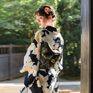 Back view of a Japanese kimono dress with a floral pattern and intricate obi belt, perfect for festivals and traditional events.