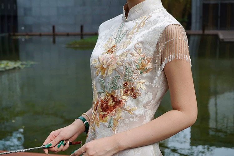Golden Tang Ode modern cheongsam with floral embroidery