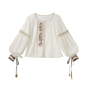 Ivory round-neck blouse displayed separately