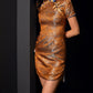 Brown brocade cheongsam with intricate patterns and side slit.