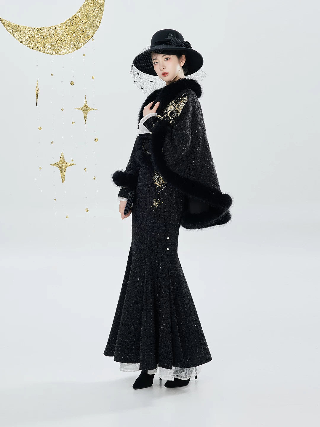 Black fishtail qipao with gold-detail cape, side pose