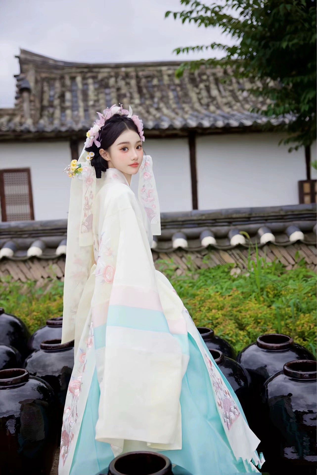 Muzhi Korean embroidered wedding dress in soft yellow, featuring delicate floral embroidery and pastel hues for a timeless bridal appearance.