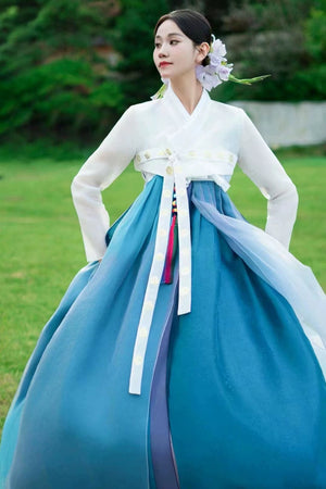 Blue Hanbok 2025 new princess palace wedding dress with white jeogori and flowing blue chima, ideal for cultural performances or weddings.