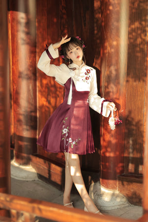 Elegant Chinese-style Lolita cheongsam featuring floral embroidery, cream top, burgundy skirt, and pearl tassel details.