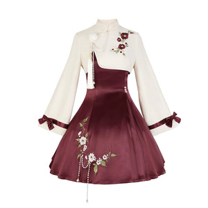 Elegant Camellia Lolita cheongsam with cream top, burgundy skirt, floral embroidery, and pearl tassel accents.