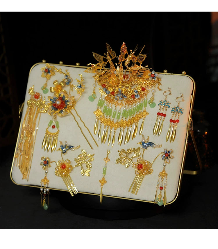 Elegant Chinese bridal hairpin set with butterfly and tassel designs, featuring gold, red, and green accents for wedding styling.