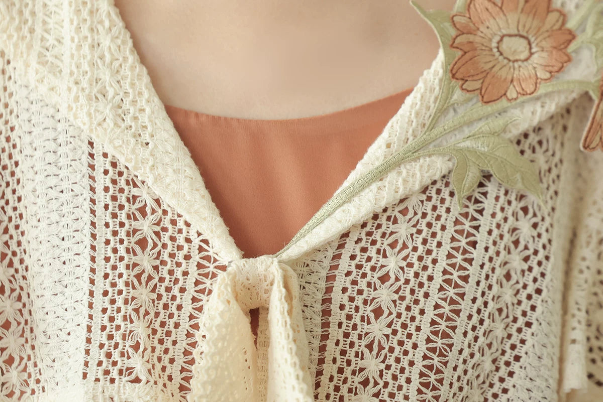 Ivory openwork lace and front tie detail