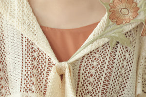Ivory openwork lace and front tie detail