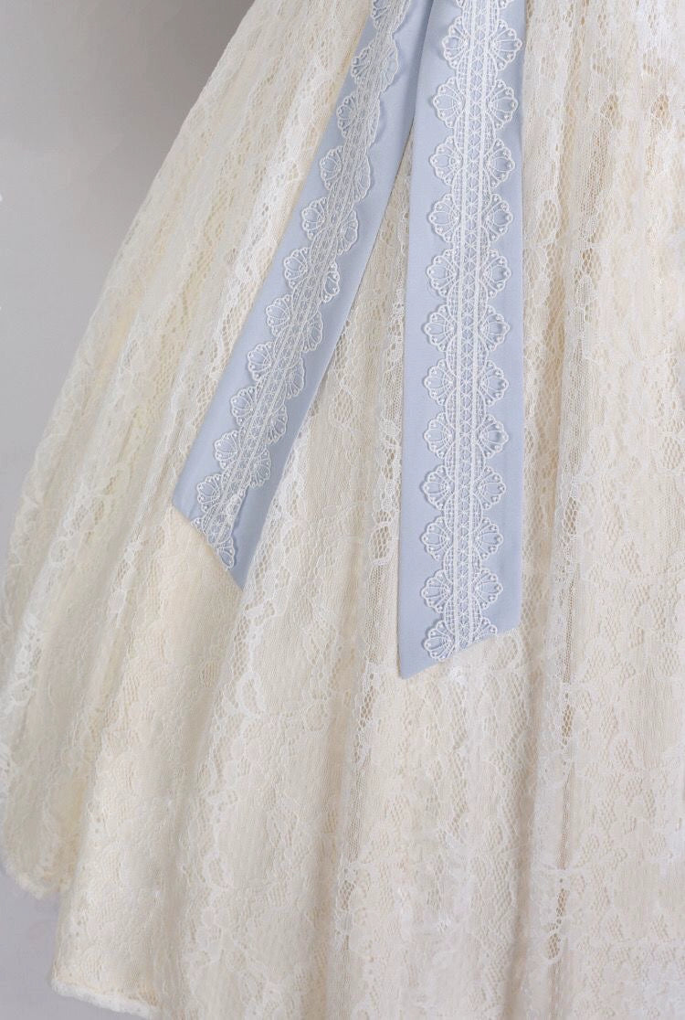 Close-up of lace skirt and blue ribbon detail on Modern Hanfu Dress, highlighting delicate craftsmanship and spring elegance.