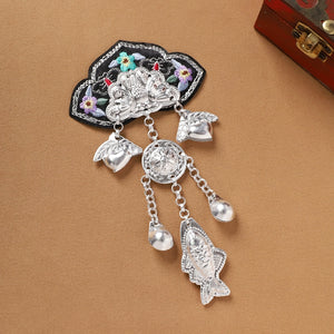 Large Guizhou Miao fridge magnet with black embroidery and silver fish, heart, and coin fringe, handmade cultural accessory.