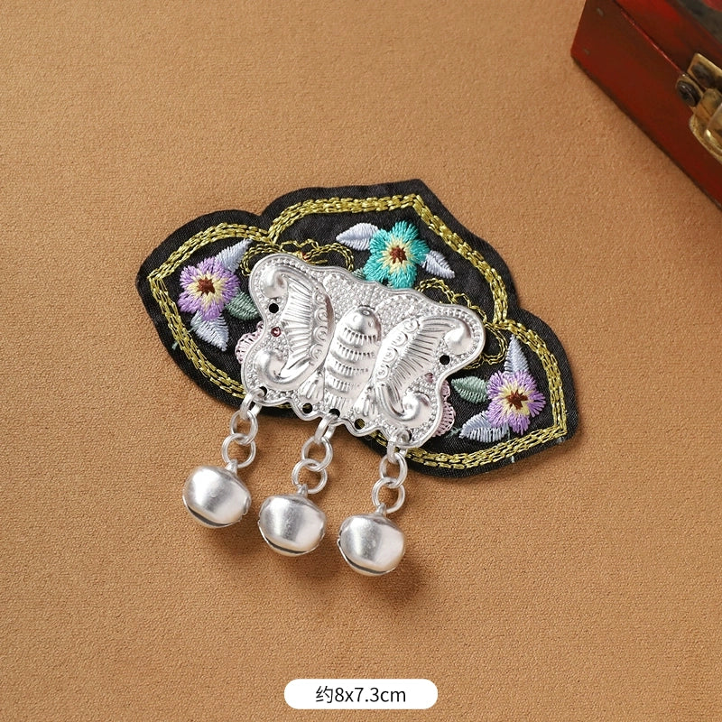 Guizhou Miao fridge magnet with black floral embroidery and silver butterfly fringe, 8x7.3cm, handmade cultural decor.