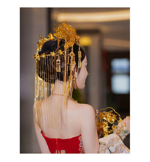 Rear view of bride in golden curtain headdress with detailed floral ornaments, designed for Chinese wedding hair styling.