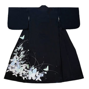 Flat-lay of black yukata kimono showcasing butterfly and floral patterns.