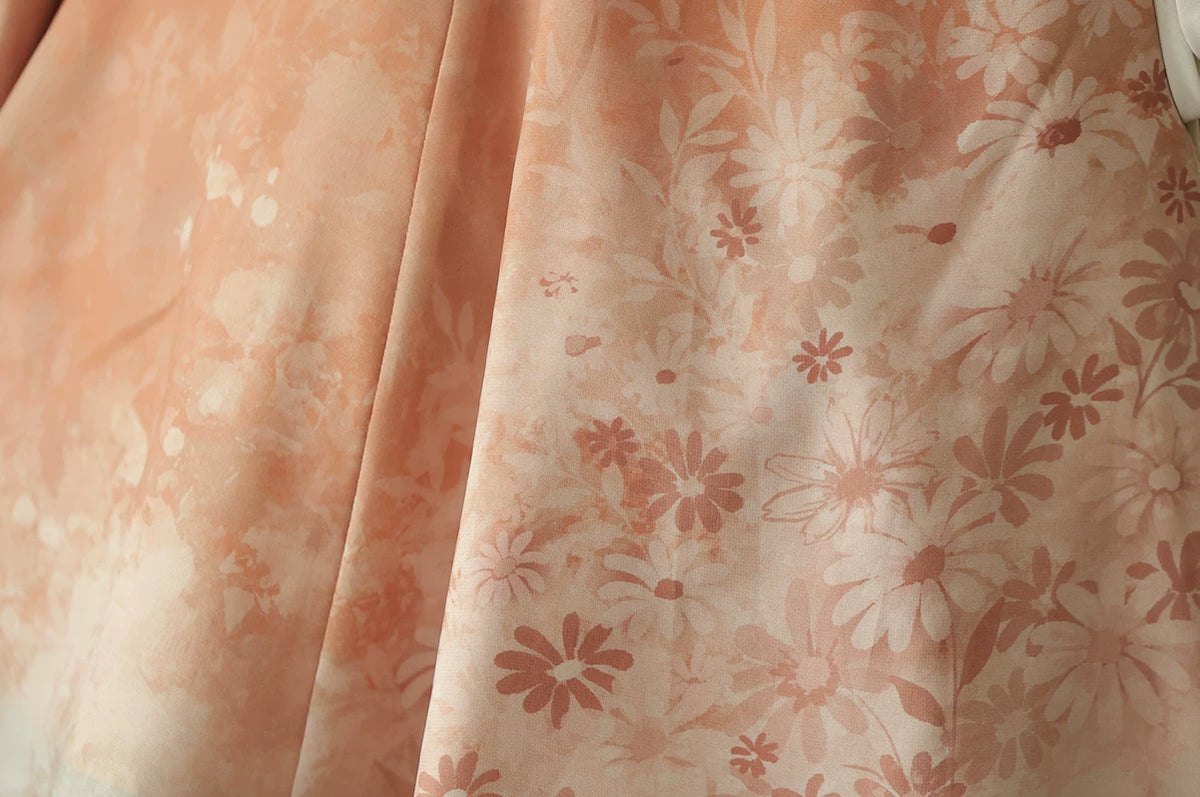 Peach floral print closeup on the skirt panel