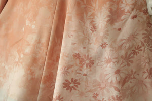 Peach floral print closeup on the skirt panel