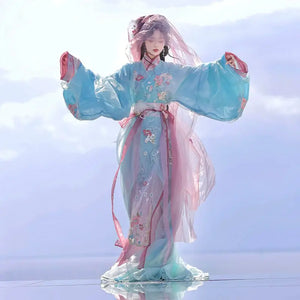 Elegant blue Hanfu with floral embroidery in sunlight