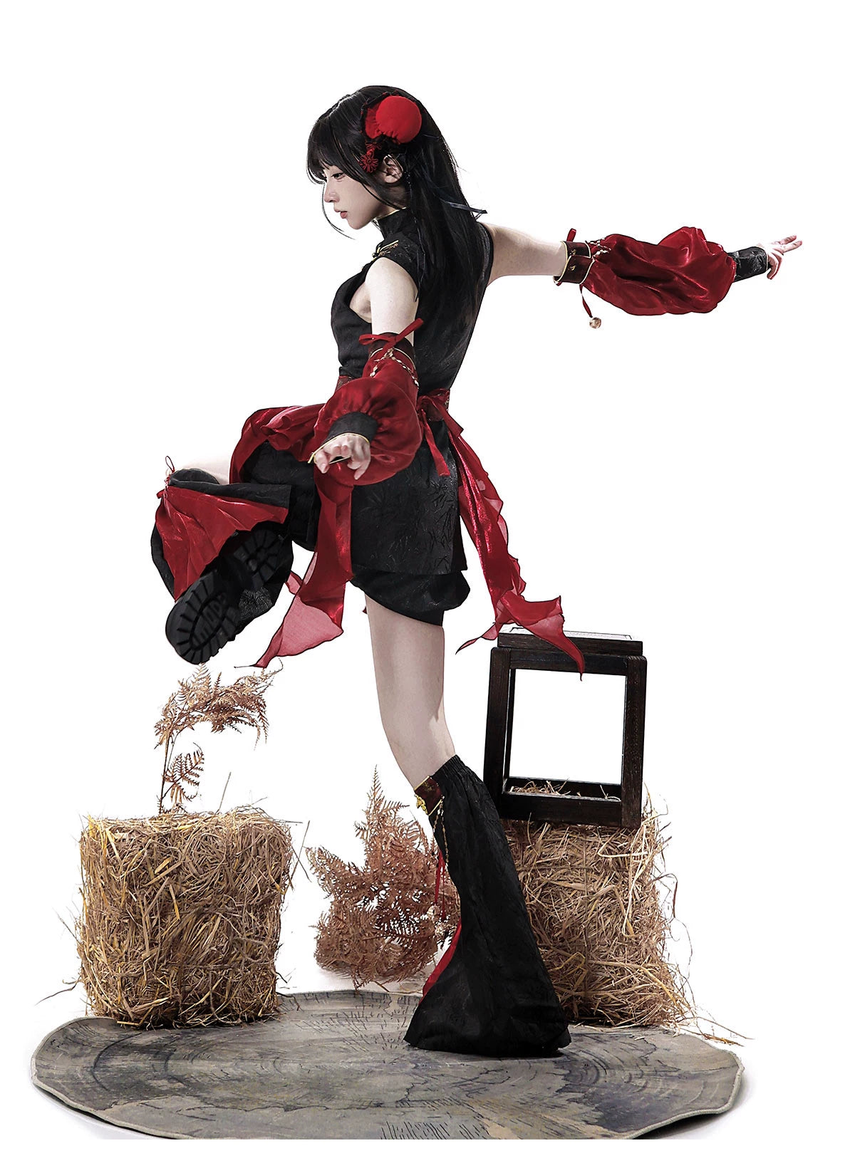 Side view of the outfit showing detached red sleeves and black leg covers